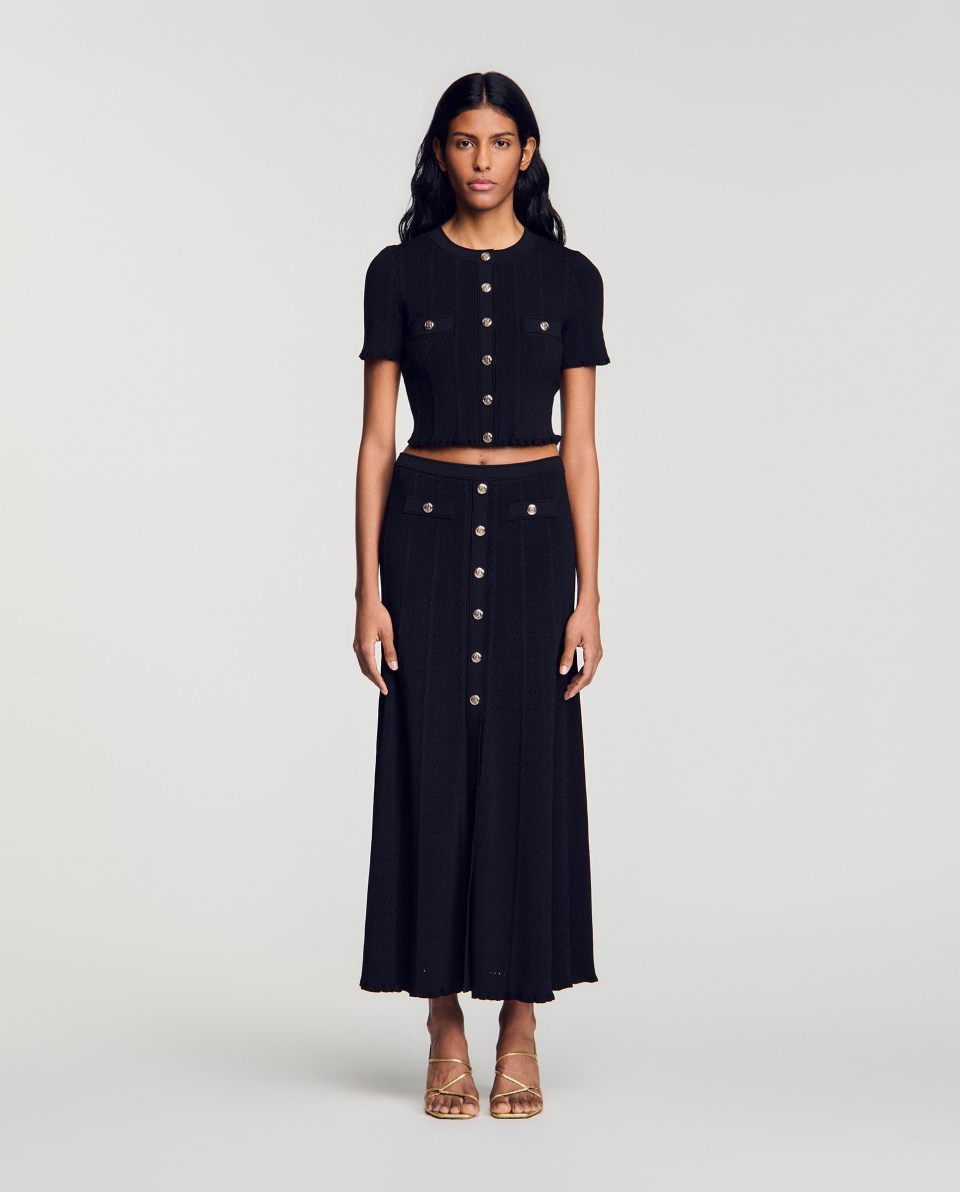 Imagen 0 de Falda midi pointelle con abertura y botones Negro