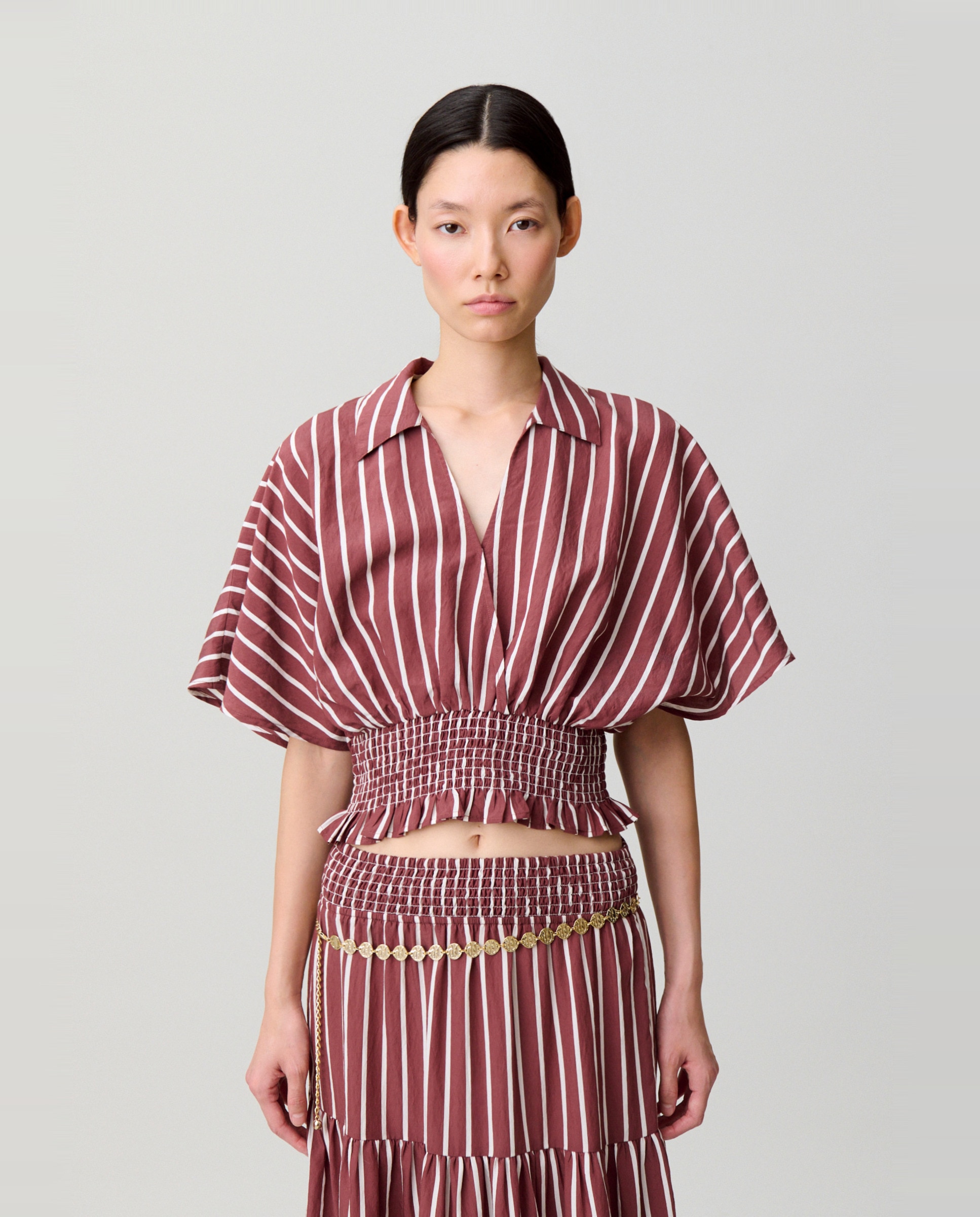 Claudie Pierlot - Top de mujer de rayas con escote cruzado.