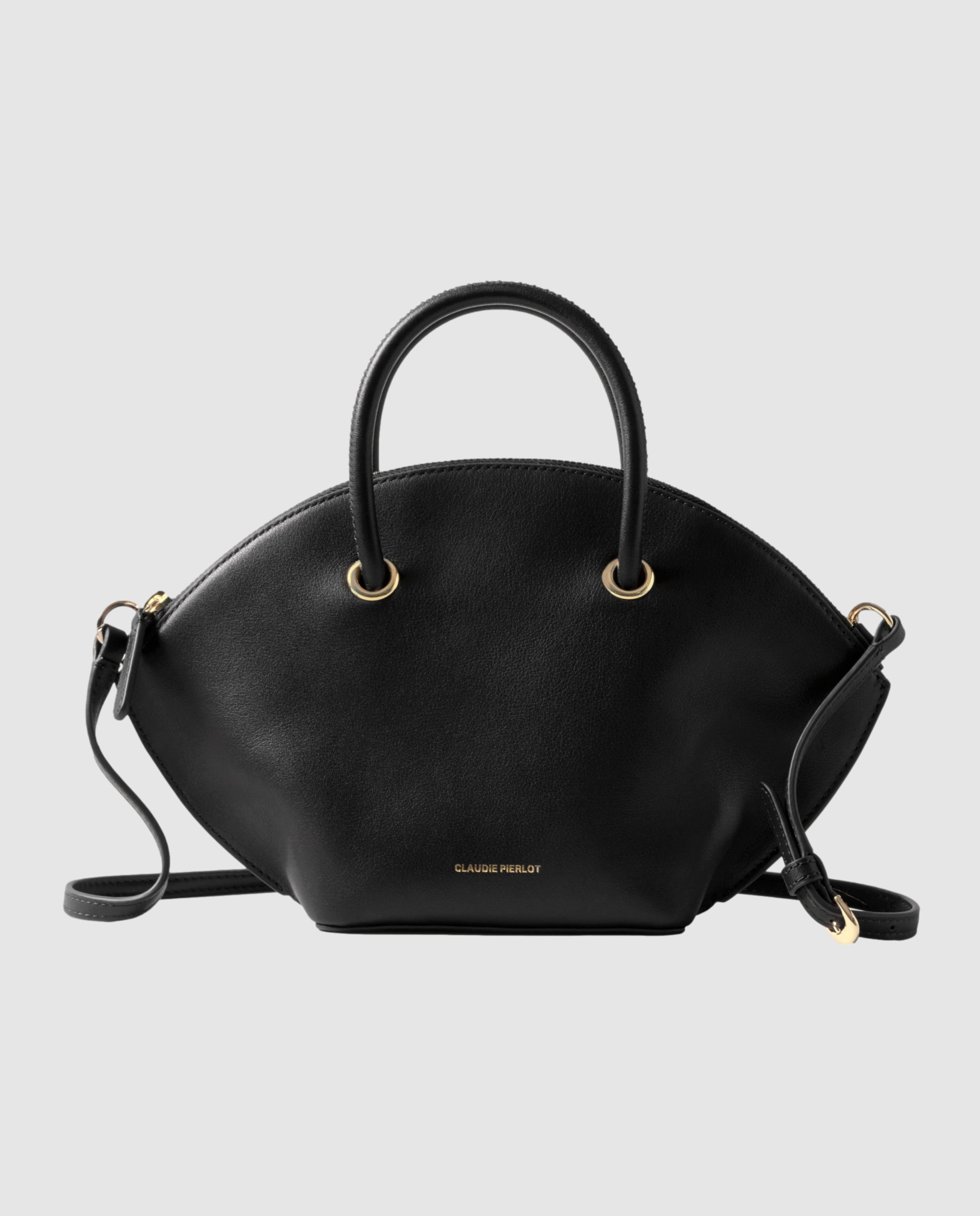 Imagen 0 de Bolso de mano de piel lisa multiposición con cierre de cremallera y anillas doradas Negro