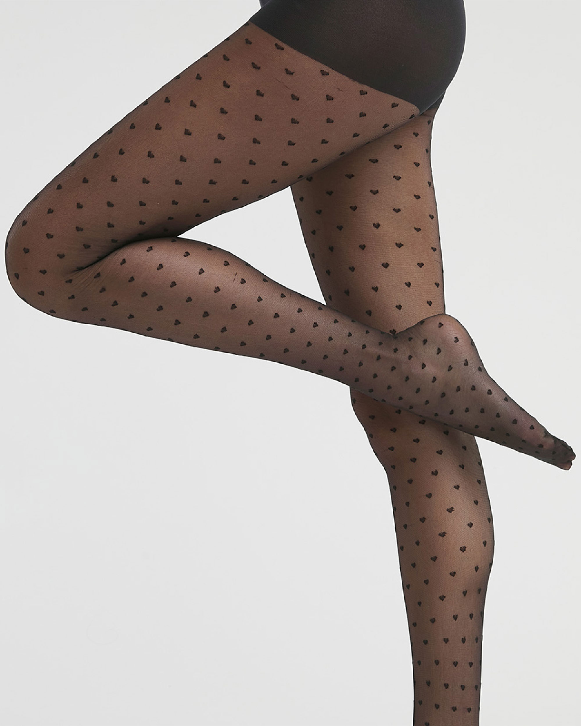 Dim - Panty transparente con corazones 19D.