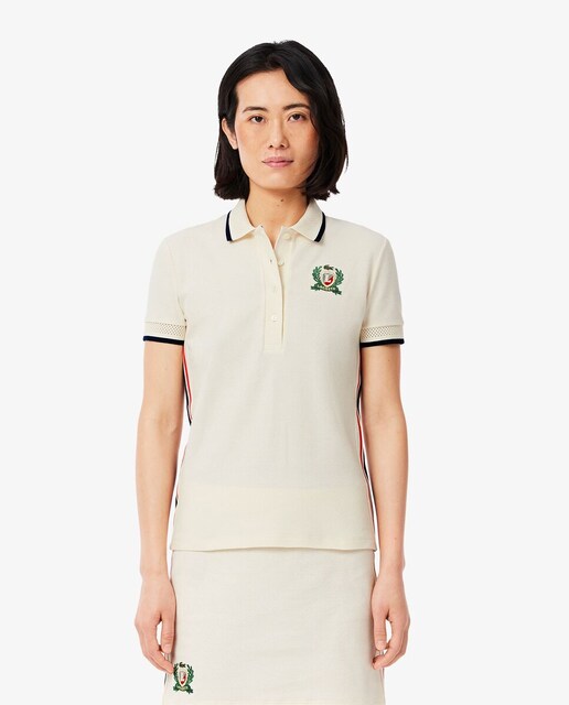 Imagen 0 de Polo de mujer ajustado de manga corta con rayas laterales a contraste