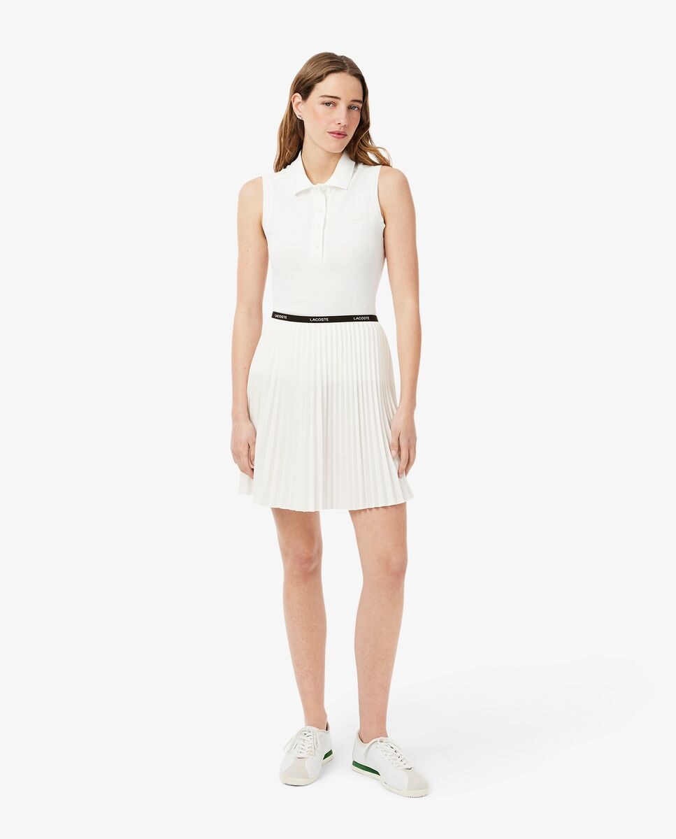 Lacoste - Falda corta plisada en blanco.