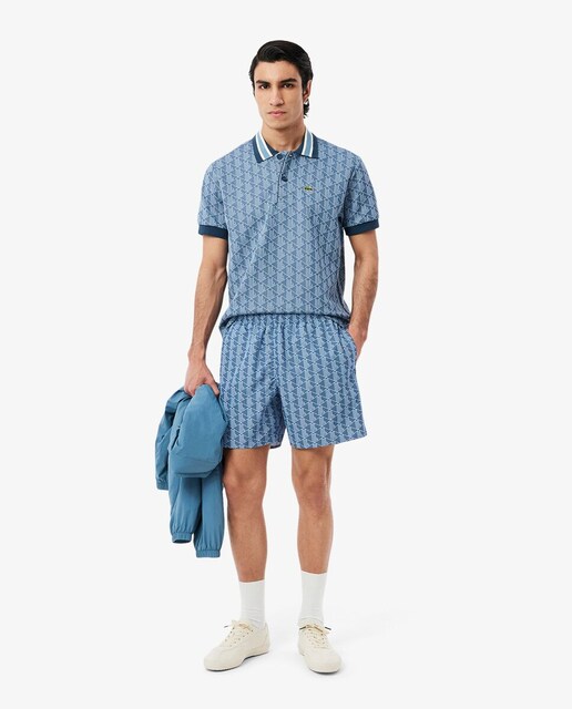 Imagen 0 de Short de baño de largo medio con estampado de monograma en azul