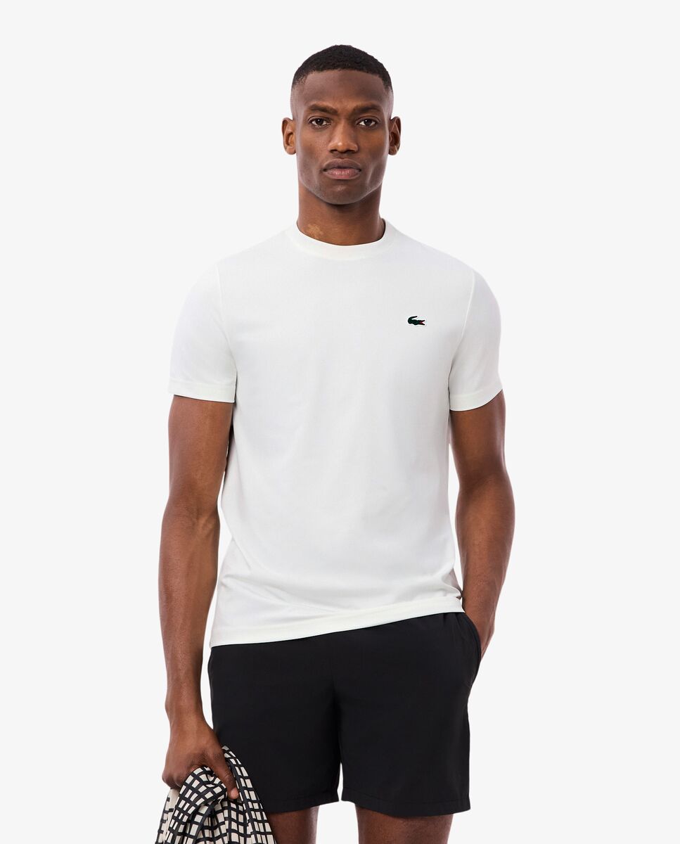 Lacoste - Camiseta de hombre deportiva elástica ligera con protección UV de manga corta.