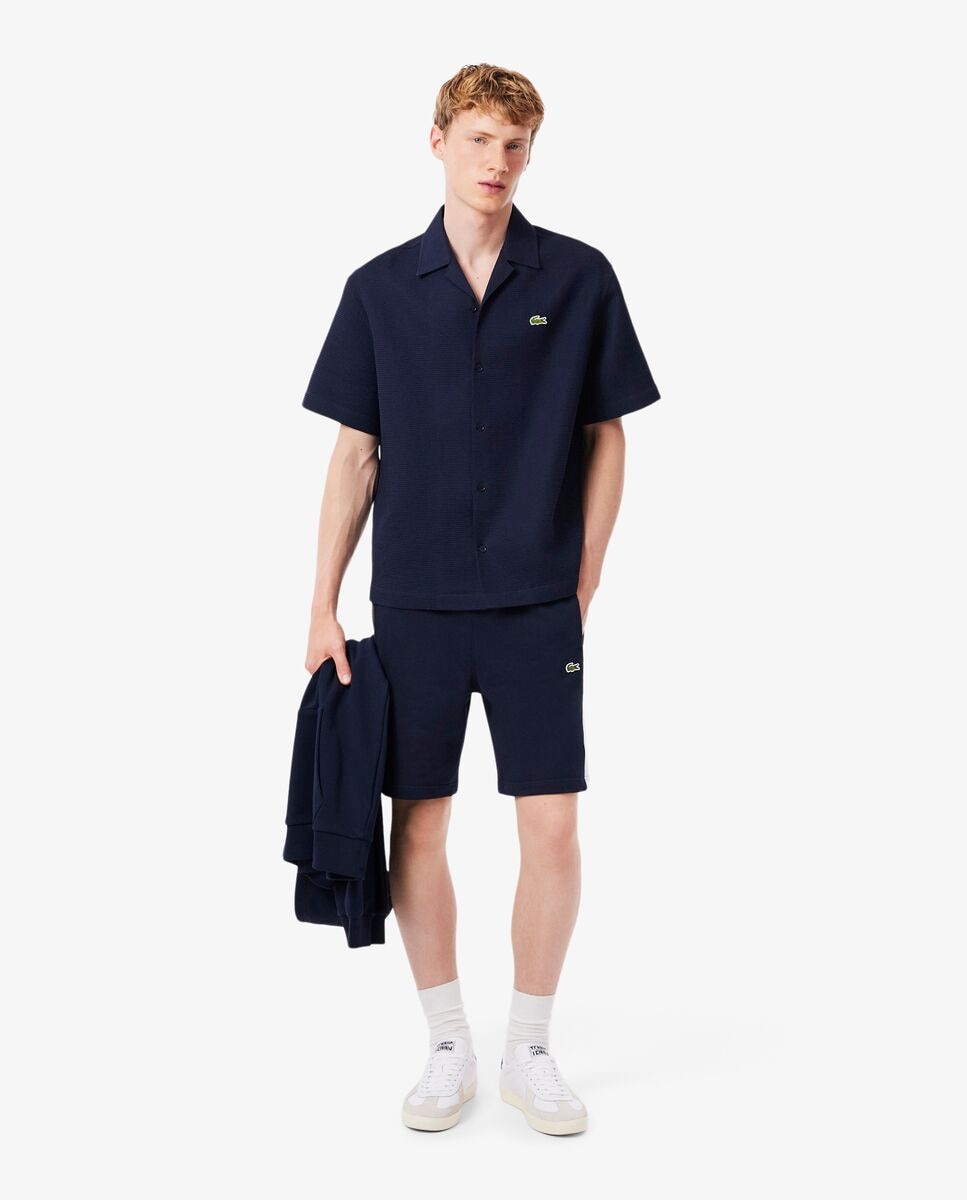 Lacoste - Pantalones cortos de hombre color block de felpa.