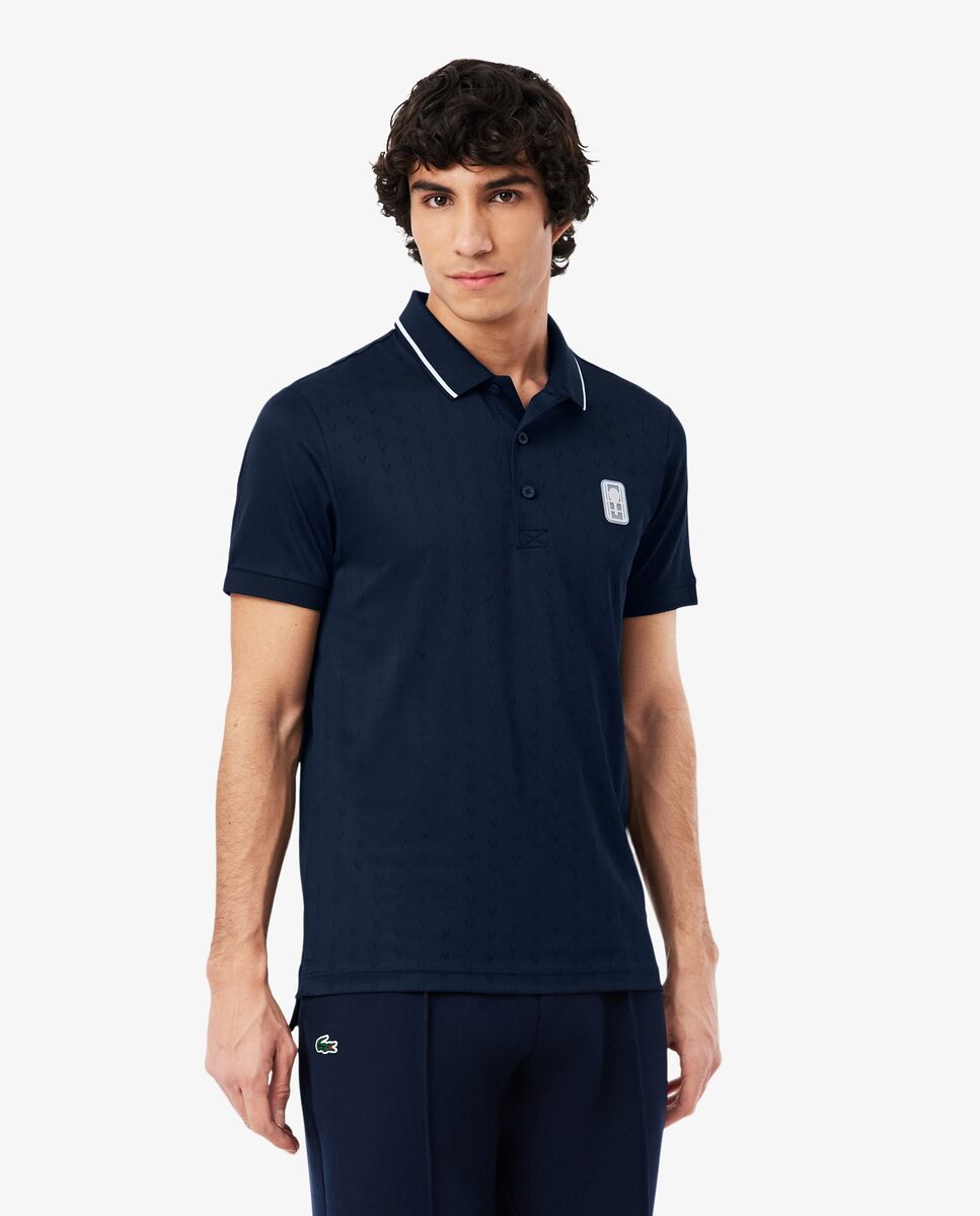 Lacoste - Polo de hombre de tenis Ultra-Dry Heritage de manga corta.