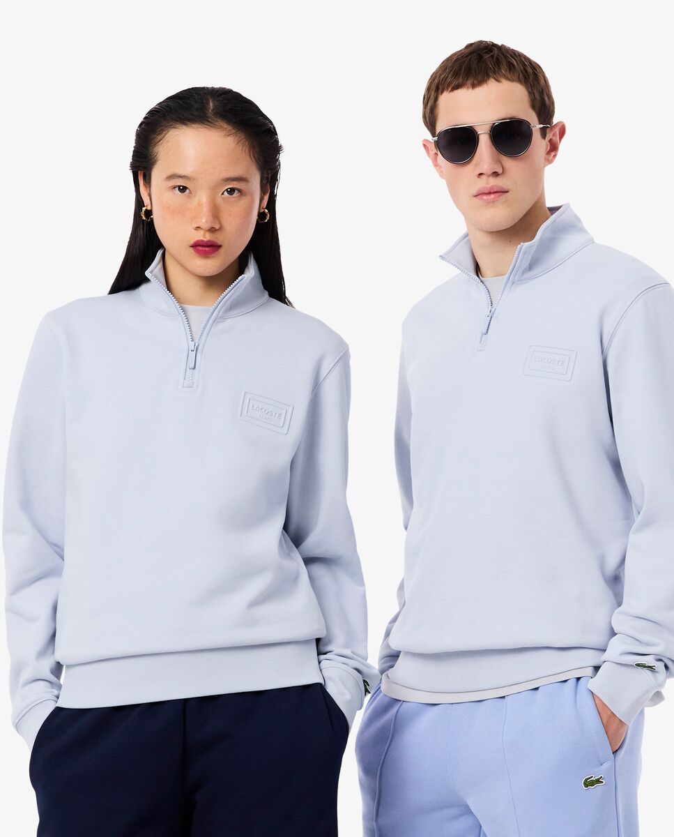 Lacoste - Sudadera unisex de cuello alto con cremallera y estampado en relieve en azul.