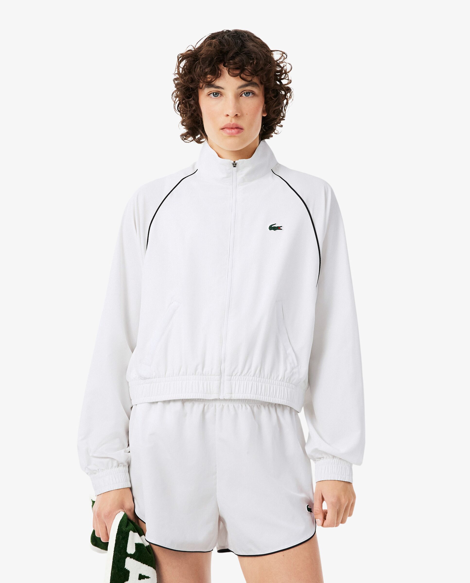 Imagen 0 de Chaqueta de mujer deportiva hidrófuga con ribete en contraste en blanco de manga larga Negro