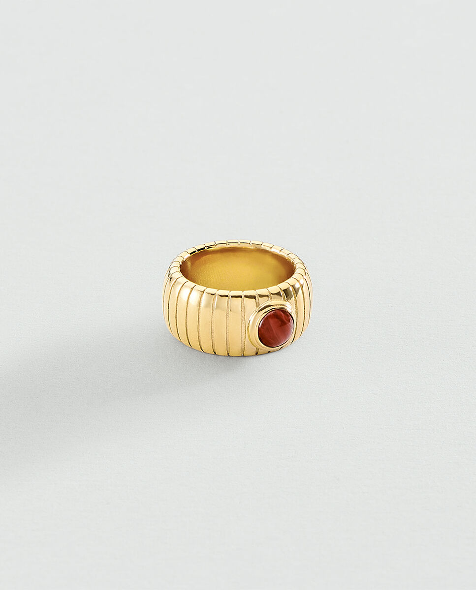 Anillo be de acero con cabujón de color en el centro