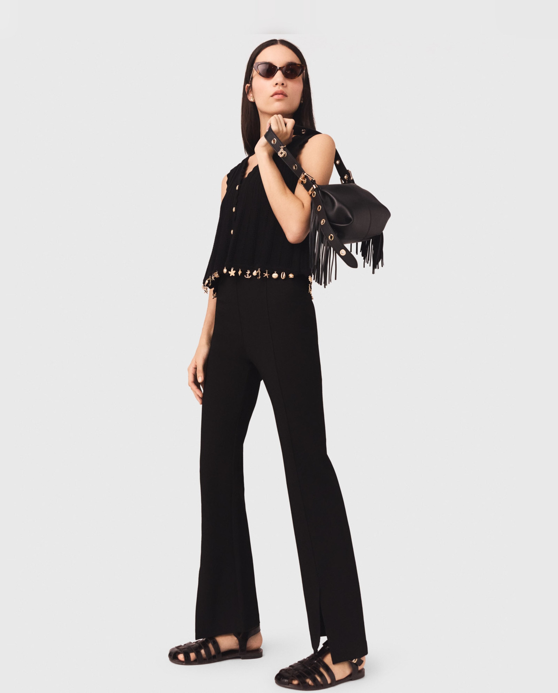 Maje - Pantalones de campana de mujer elegantes con abertura.