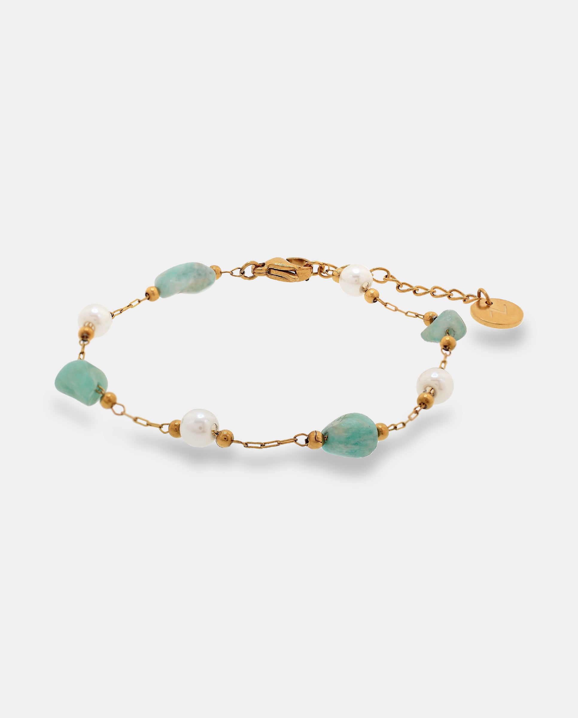 Imagen 0 de Pulsera de cadena en acero dorado con piedras irregulares y redondas Blanco