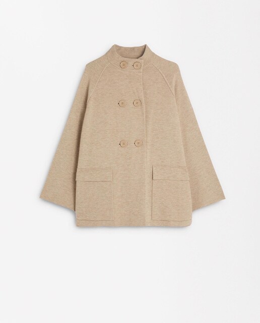 Imagen 0 de Poncho de mujer de punto con botones en liso