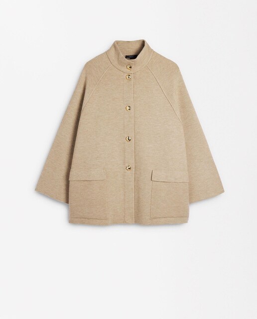 Imagen 0 de Poncho de mujer de punto de cuello alto con botones en liso