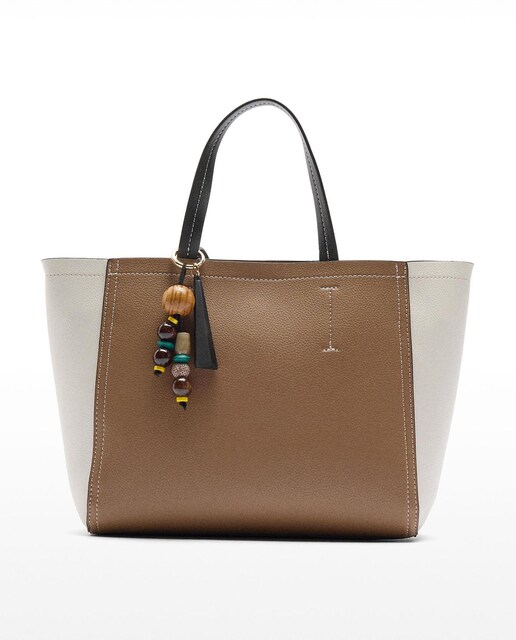 Imagen 0 de Bolso de mano estilo tote convertible a bandolera con cierre de cremallera en liso