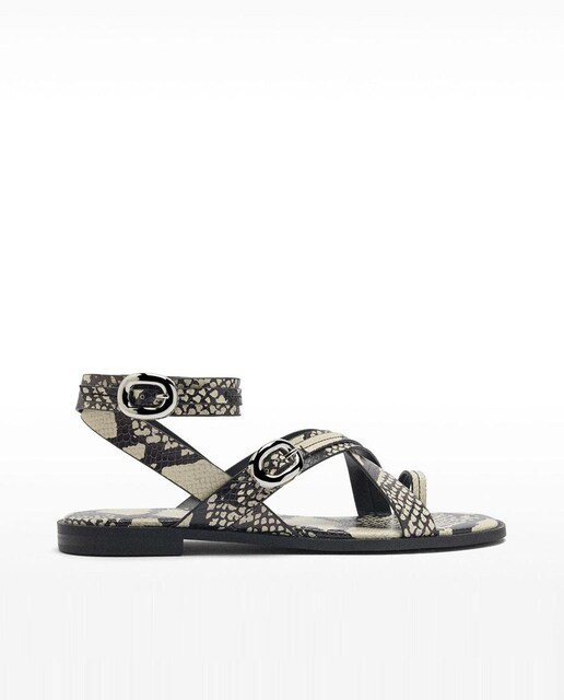 Imagen 0 de Sandalias planas de mujer con tiras cruzadas y estampado de serpiente