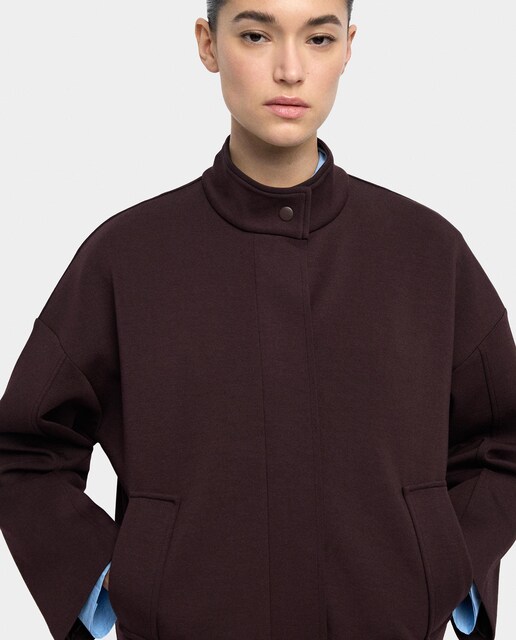 Imagen 0 de Chaqueta de mujer con cuello alto y cremallera en liso