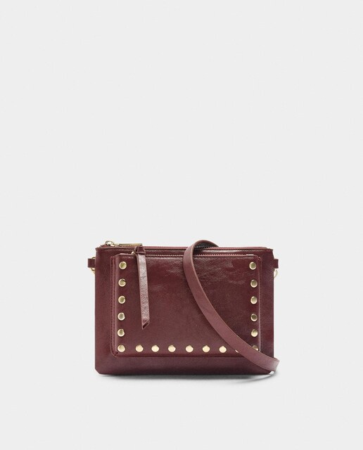 Imagen 0 de Bandolera de mujer fina con tachuelas y cierre de cremallera en liso