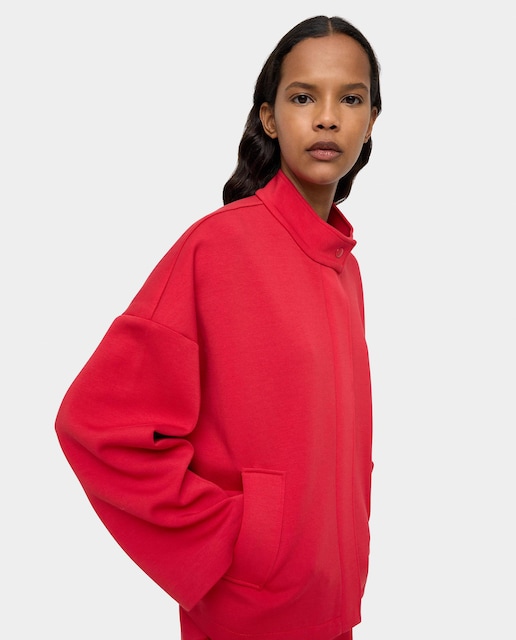 Imagen 0 de Chaqueta de mujer con bolsillos laterales y cierre de cremallera oculto