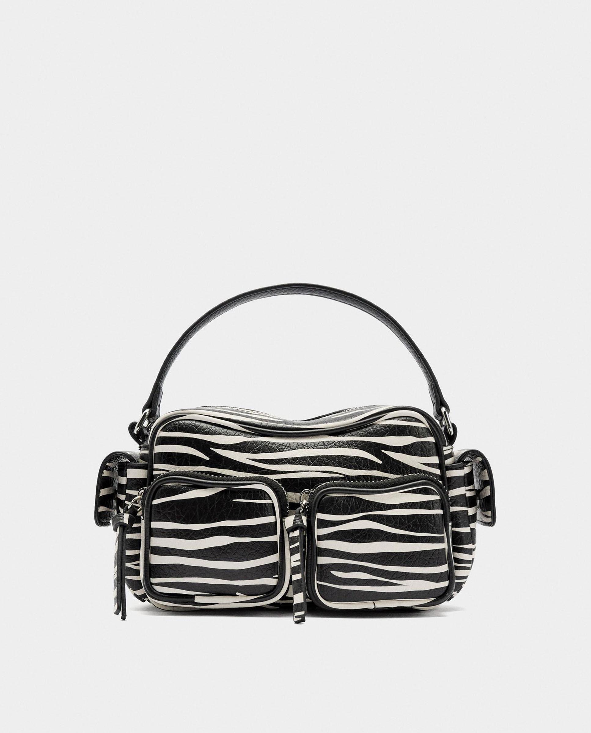 Bandolera de mujer multiposición con cierre de cremallera y varios compartimentos con estampado animal print