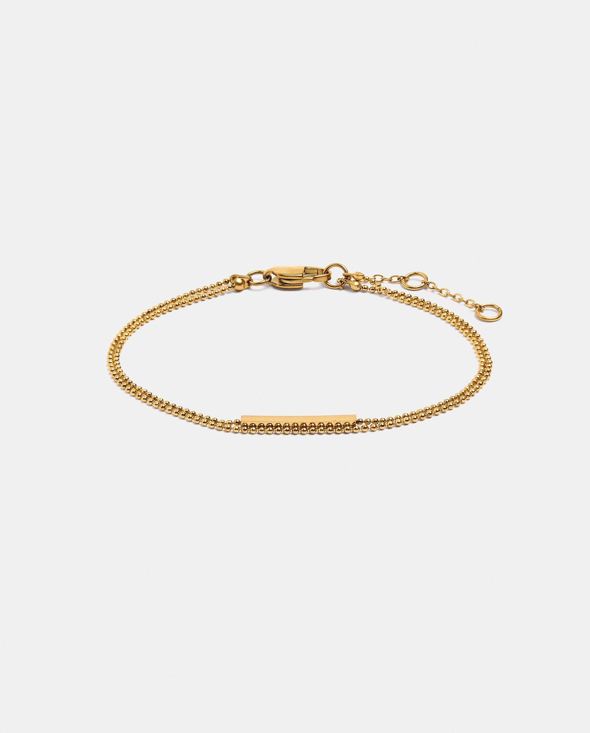 Imagen 1 de Pulsera de acero inoxidable fina con abalorios decorativos Dorado