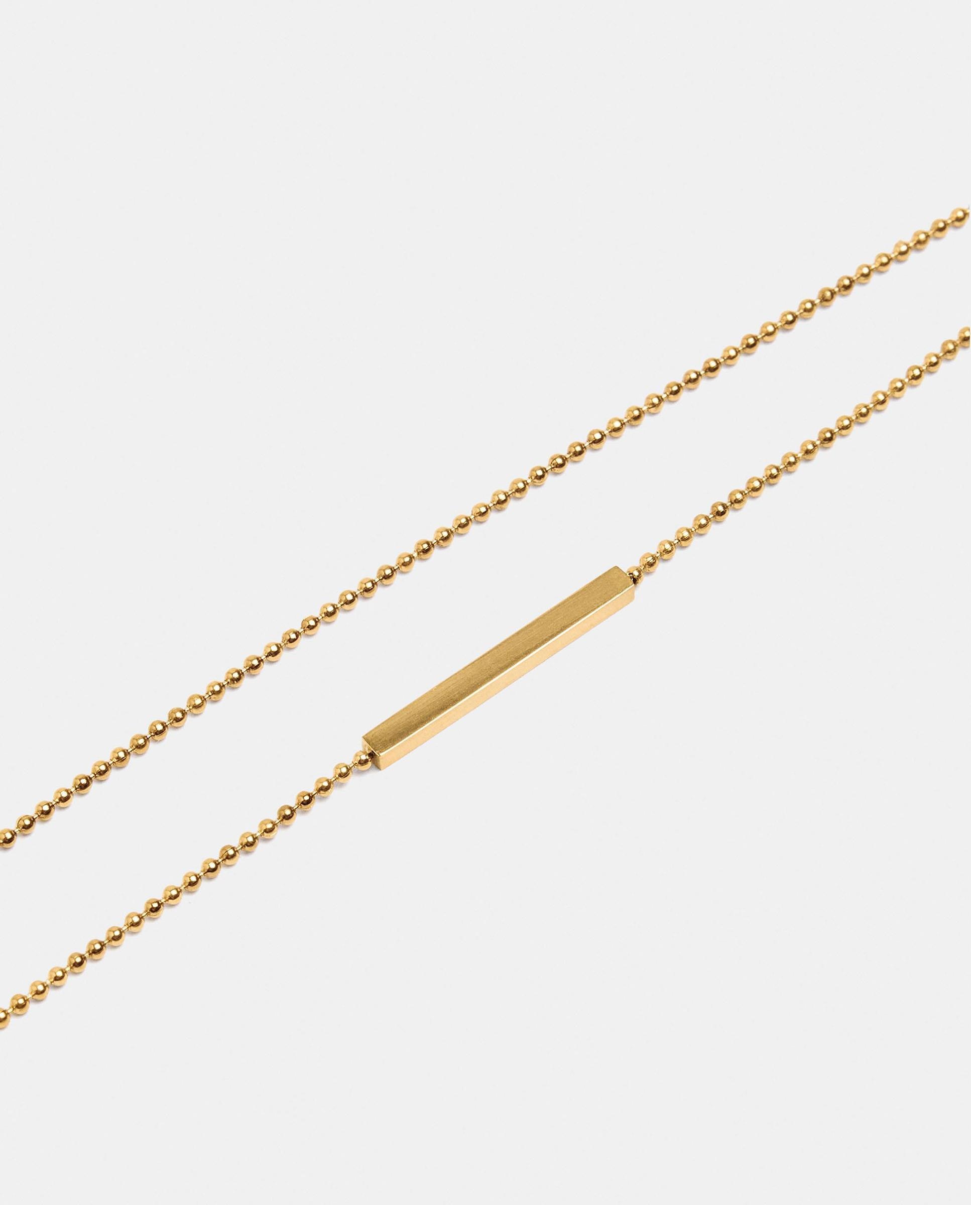 Imagen 2 de Pulsera de acero inoxidable fina con abalorios decorativos - Parfois - Dorado Dorado