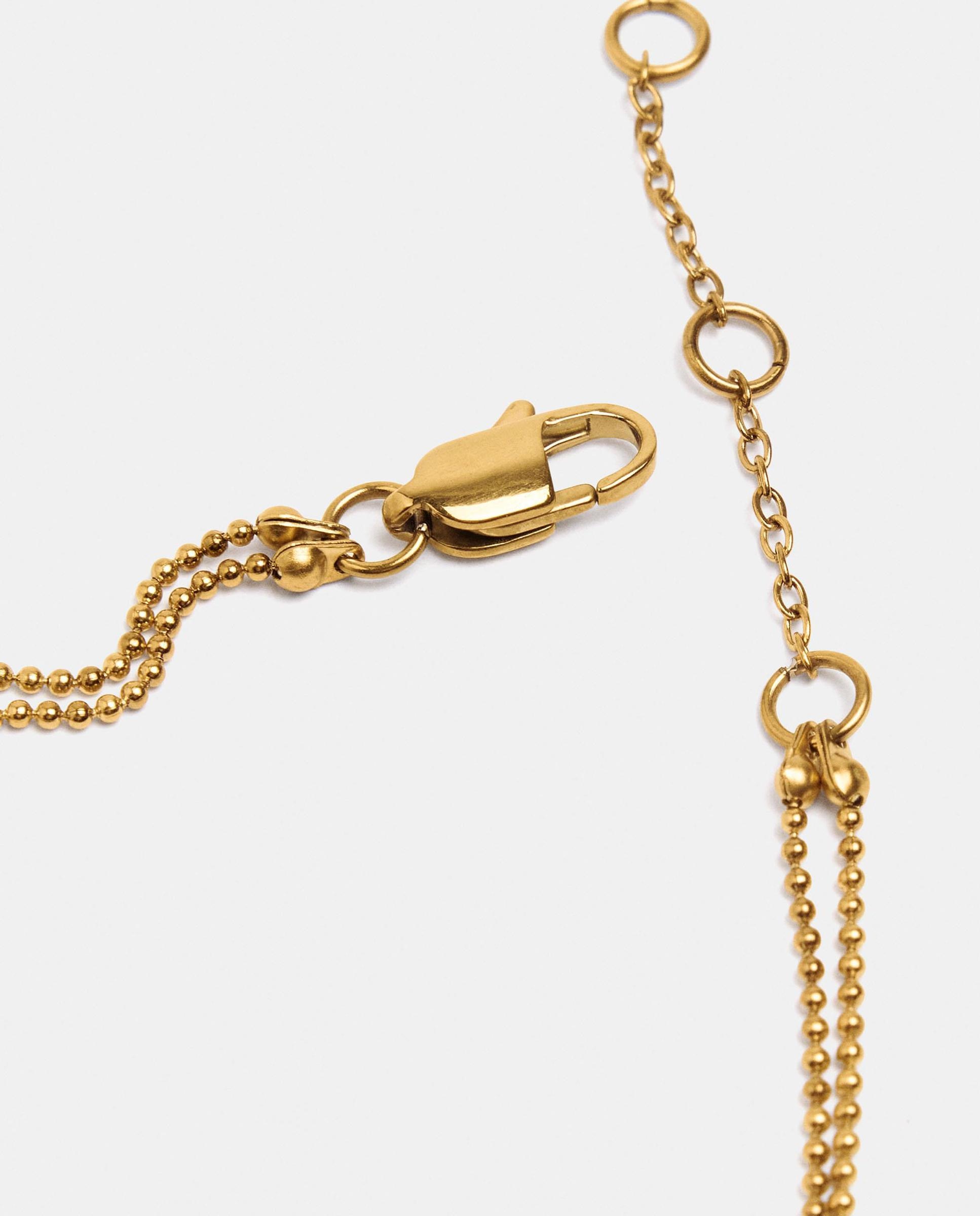 Imagen 3 de Pulsera de acero inoxidable fina con abalorios decorativos - Parfois - Dorado Dorado
