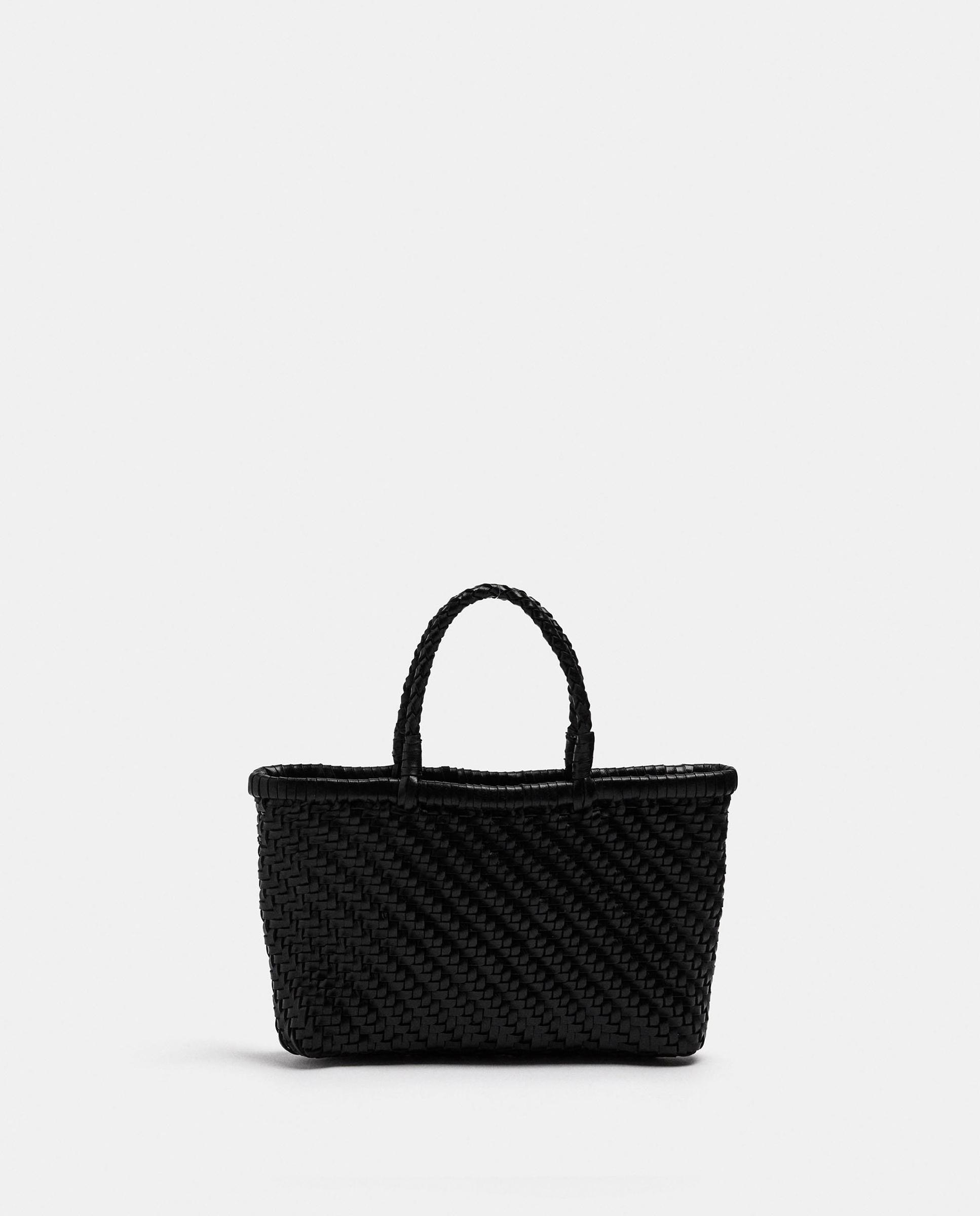 Imagen 1 de Bolso de mano 100% piel trenzado estilo tote convertible a bandolera con cierre de cuerda y neceser extraíble Negro