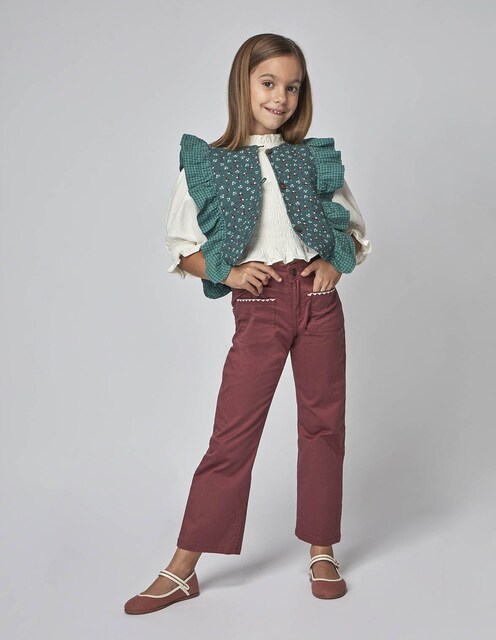 Imagen 0 de Chaleco de niña con volante con estampados combinados