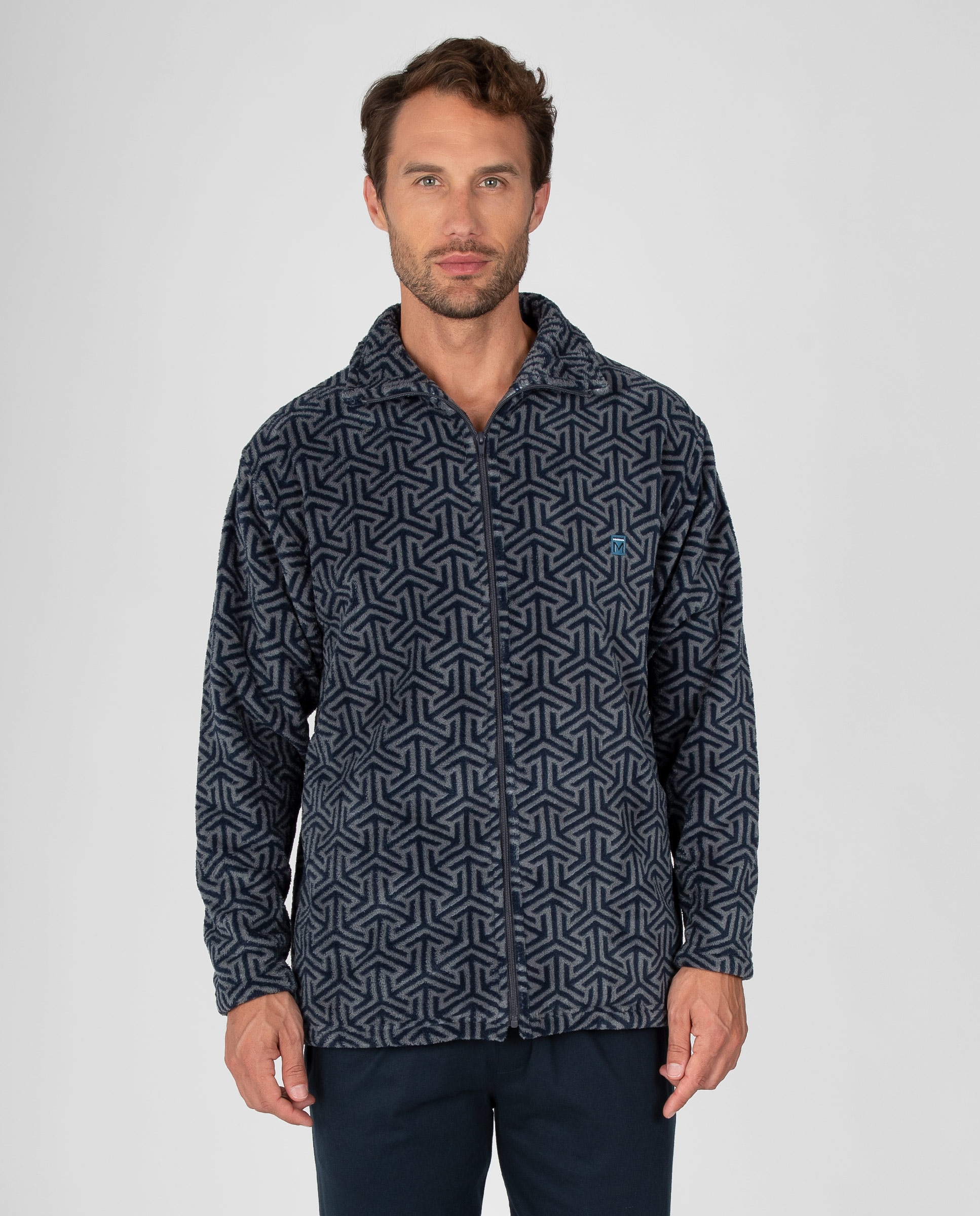 Imagen 1 de Bata corta de hombre en tejido polar con estampado de líneas entrelazadas, cremallera y bolsillos la Azul