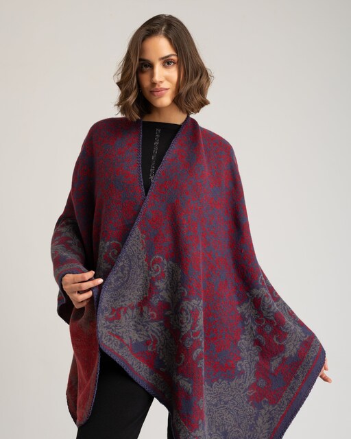 Imagen 0 de Poncho de mujer de punto jacquard bicolor