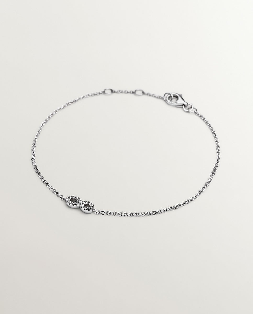 Imagen 1 de Pulsera de oro blanco de 18k con infinito y diamantes - Plata Plata
