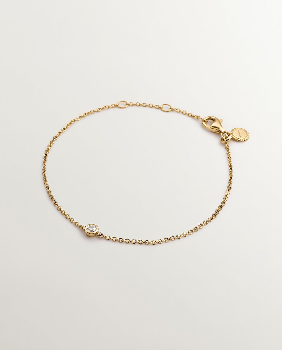 Imagen 0 de Pulsera solitario de plata 925 bañada en oro amarillo de 18k con topacio blanco Blanco