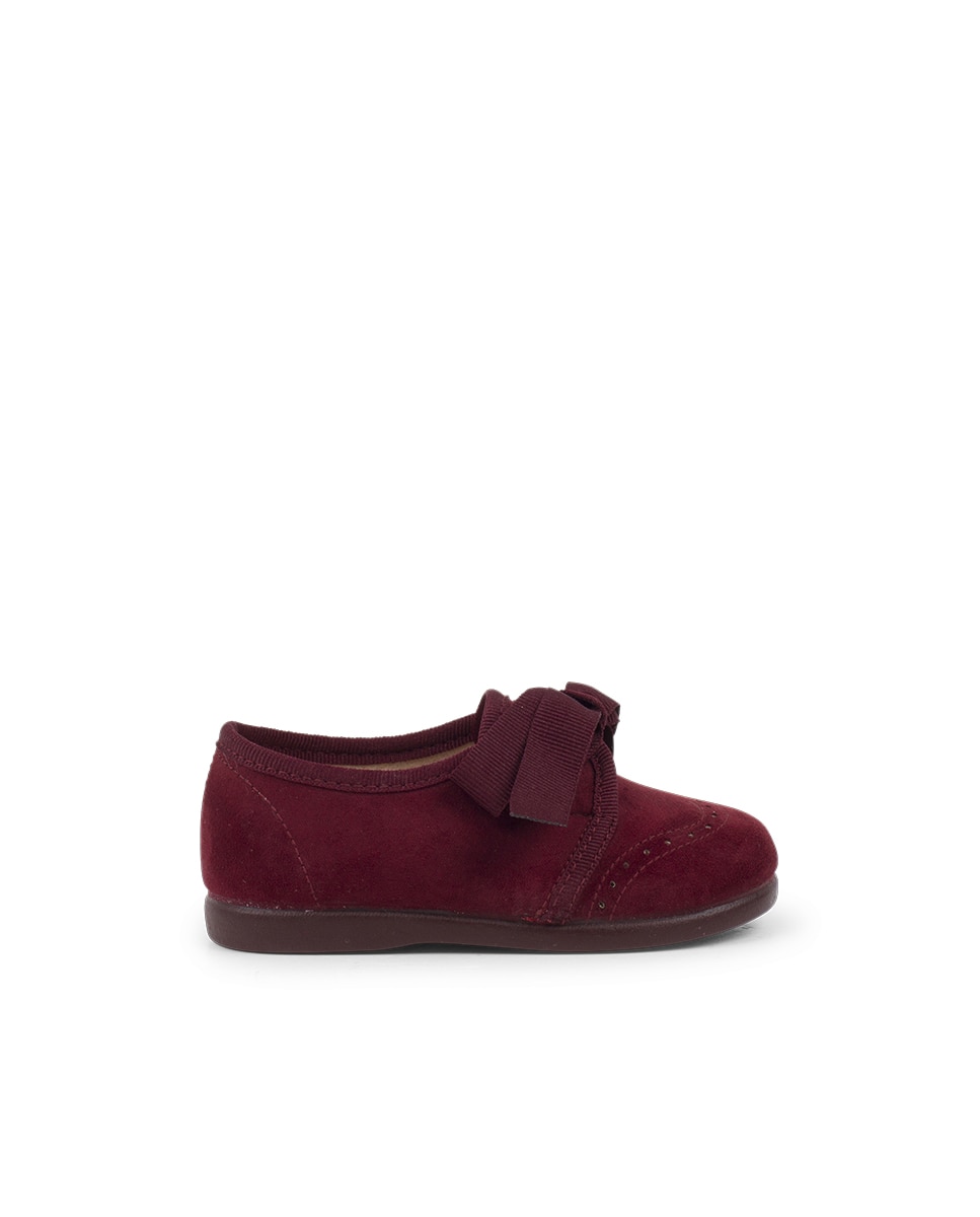 Zapato de cordones de bebé con lazo y picados