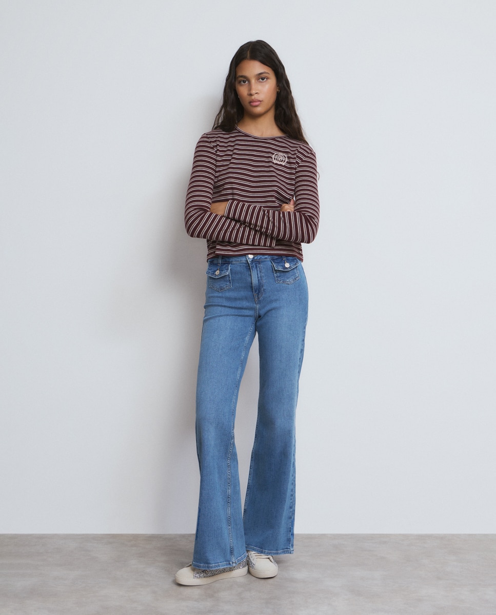Brownie - Vaquero campana de mujer con bolsillos frontales.