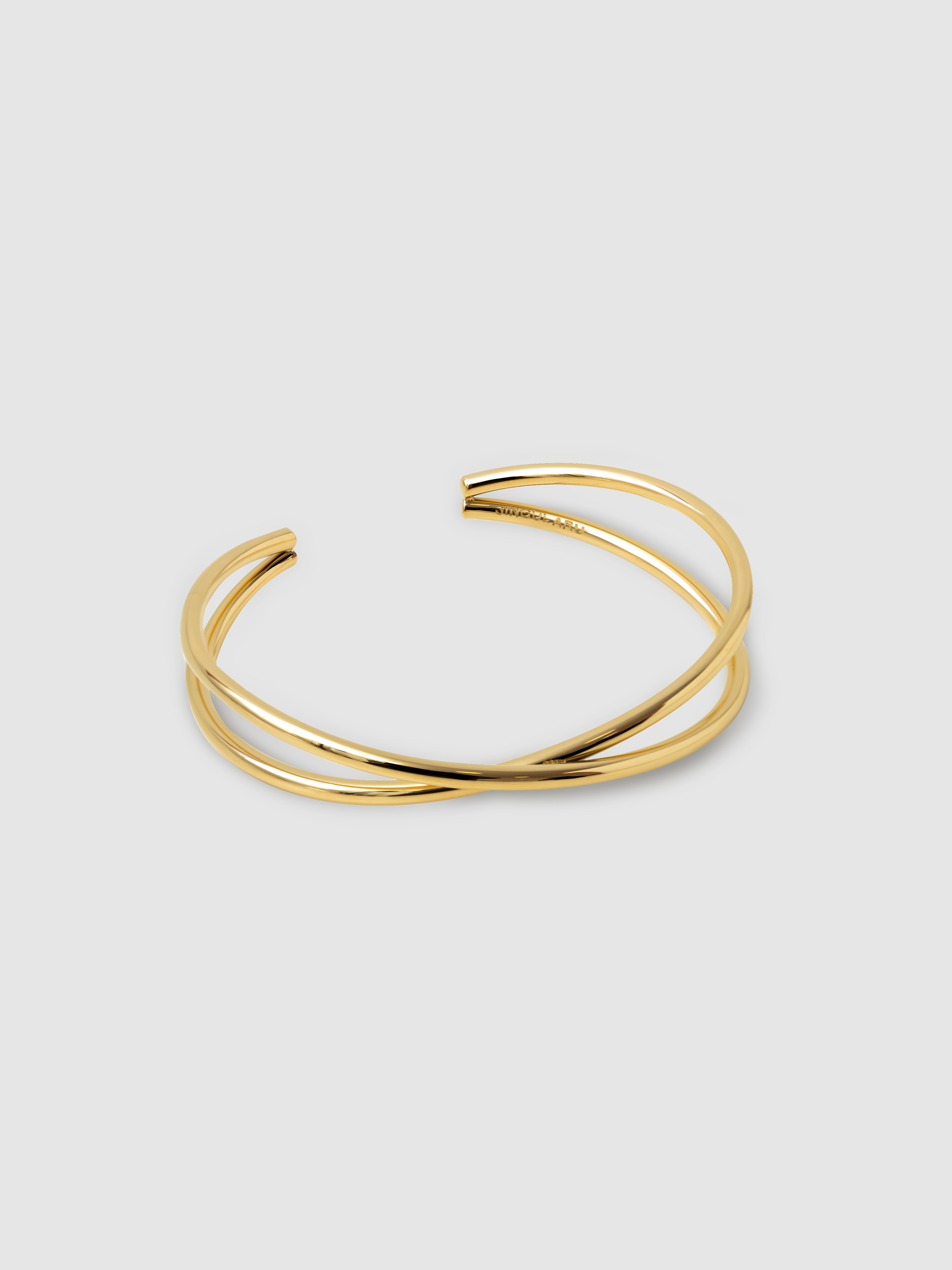 Brazalete Cruzado de acero bañado en oro