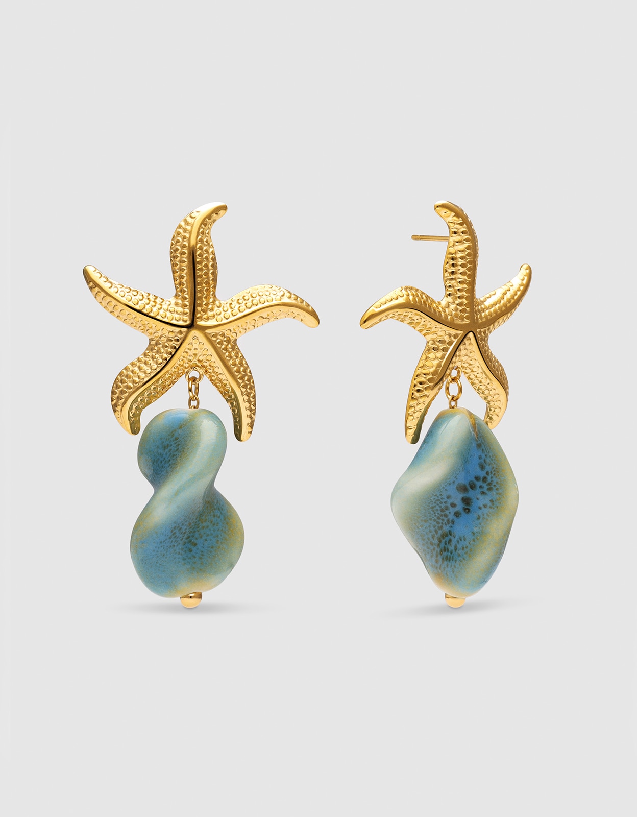 Pendientes starfish wave de acero bañado en oro