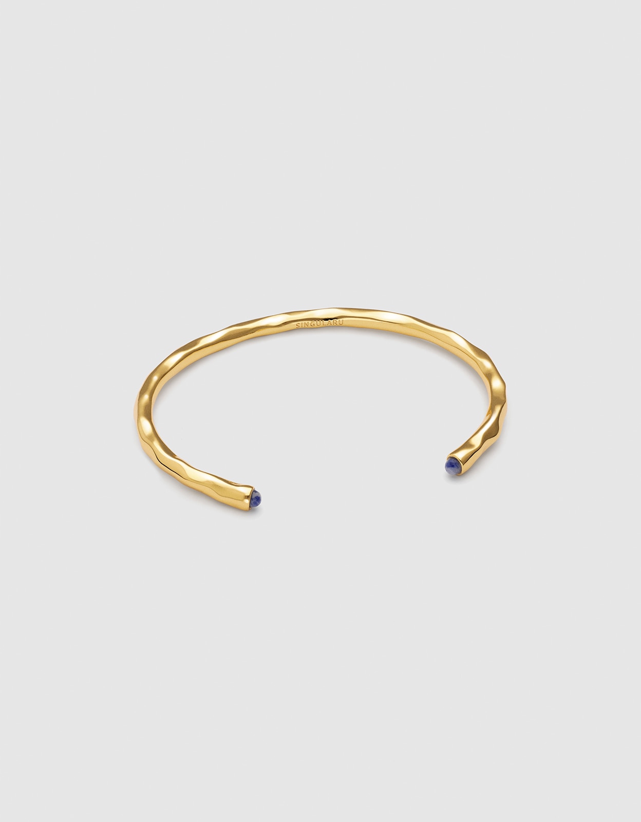 Imagen 0 de Brazalete cane cianita de aleación de metales bañado en oro Azul
