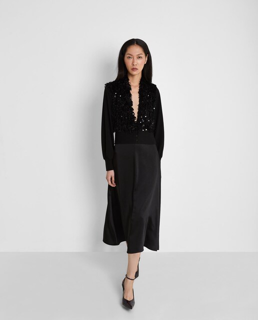 Imagen 0 de Cahqueta de mujer con detalle de pelo y lentejuelas