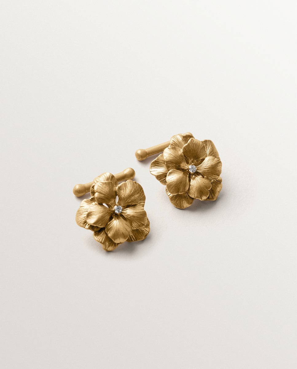 Imagen 0 de Gemelos bañados en oro amarillo con cristales y forma de flor Cristal