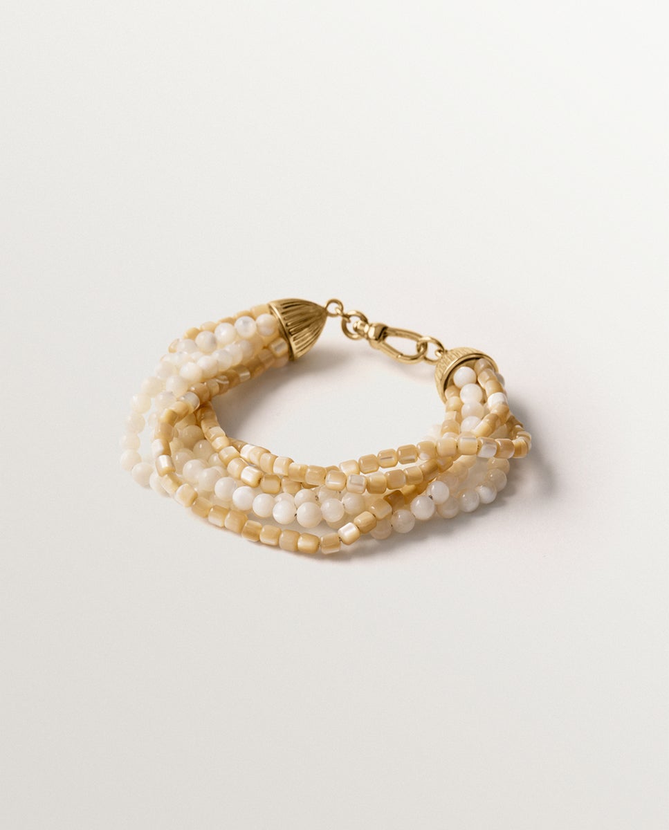 Imagen 0 de Pulsera bañada en oro amarillo con bolitas de nácar Dorado