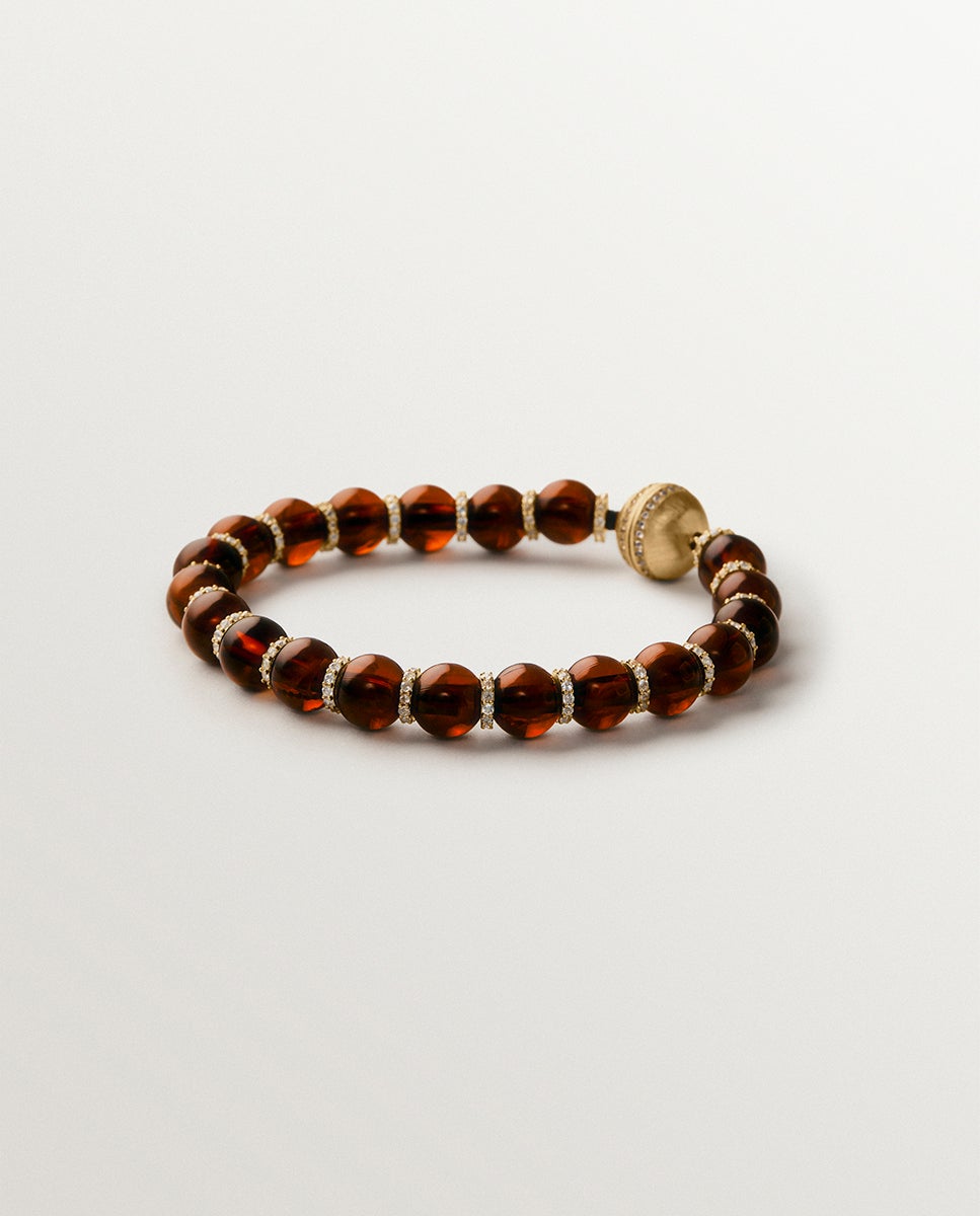 Imagen 0 de Pulsera bañada en oro amarillo de 18k con resina marrón, cristales y motivos de esferas Dorado