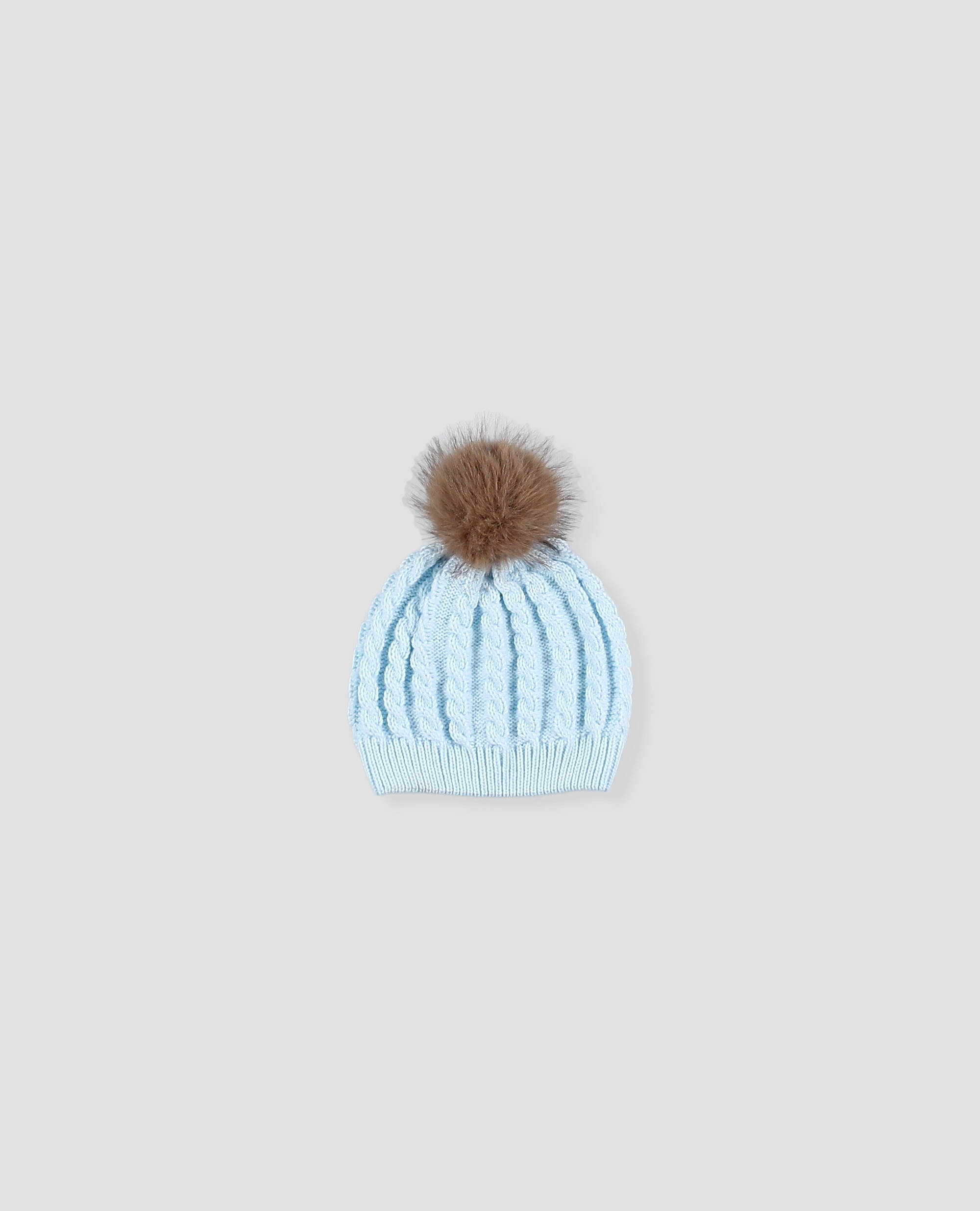 Imagen 0 de Gorro de punto en ochos para bebé con pompón de pelo Azul celeste