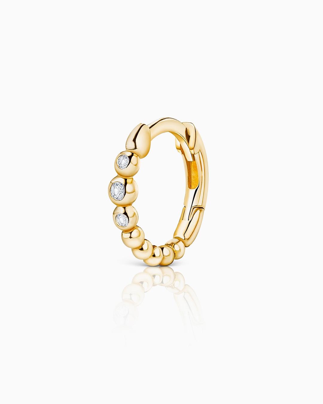 Imagen 0 de Pendiente piercing bubble diamonds en oro amarillo de 18 kt Blanco