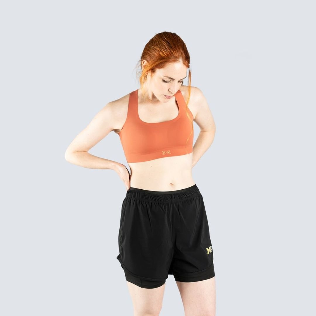Imagen 0 de Top deportivo de mujer Flow Colección Rise Picsil Naranja claro