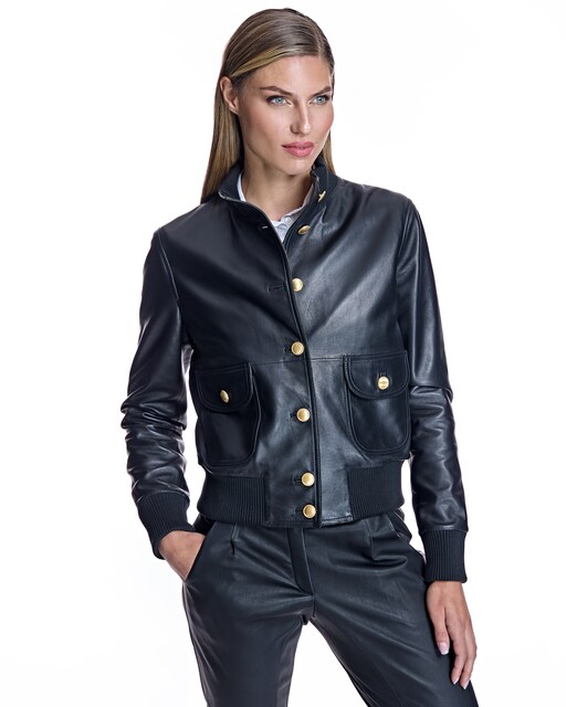 Imagen 0 de Chaqueta de piel de mujer con cuello, puños y bajo elásticos