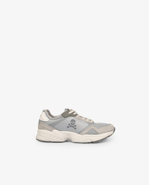 Zapatillas deportivas de mujer de color gris con calavera lateral