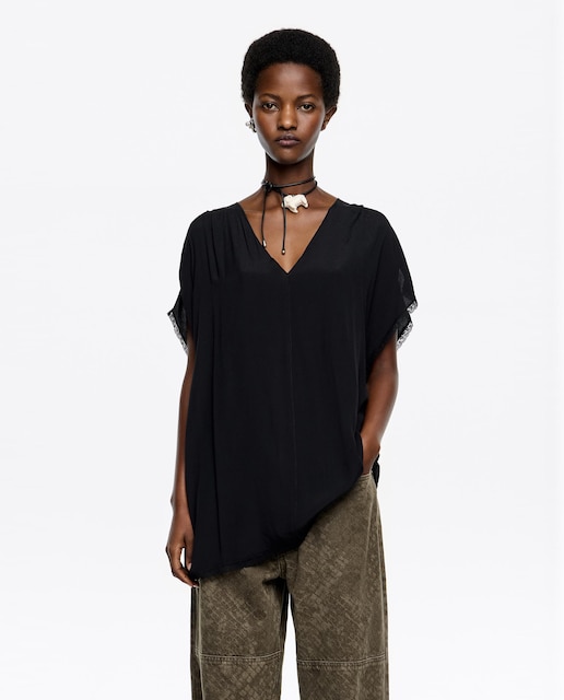 Imagen 0 de Top de mujer escote pico liso