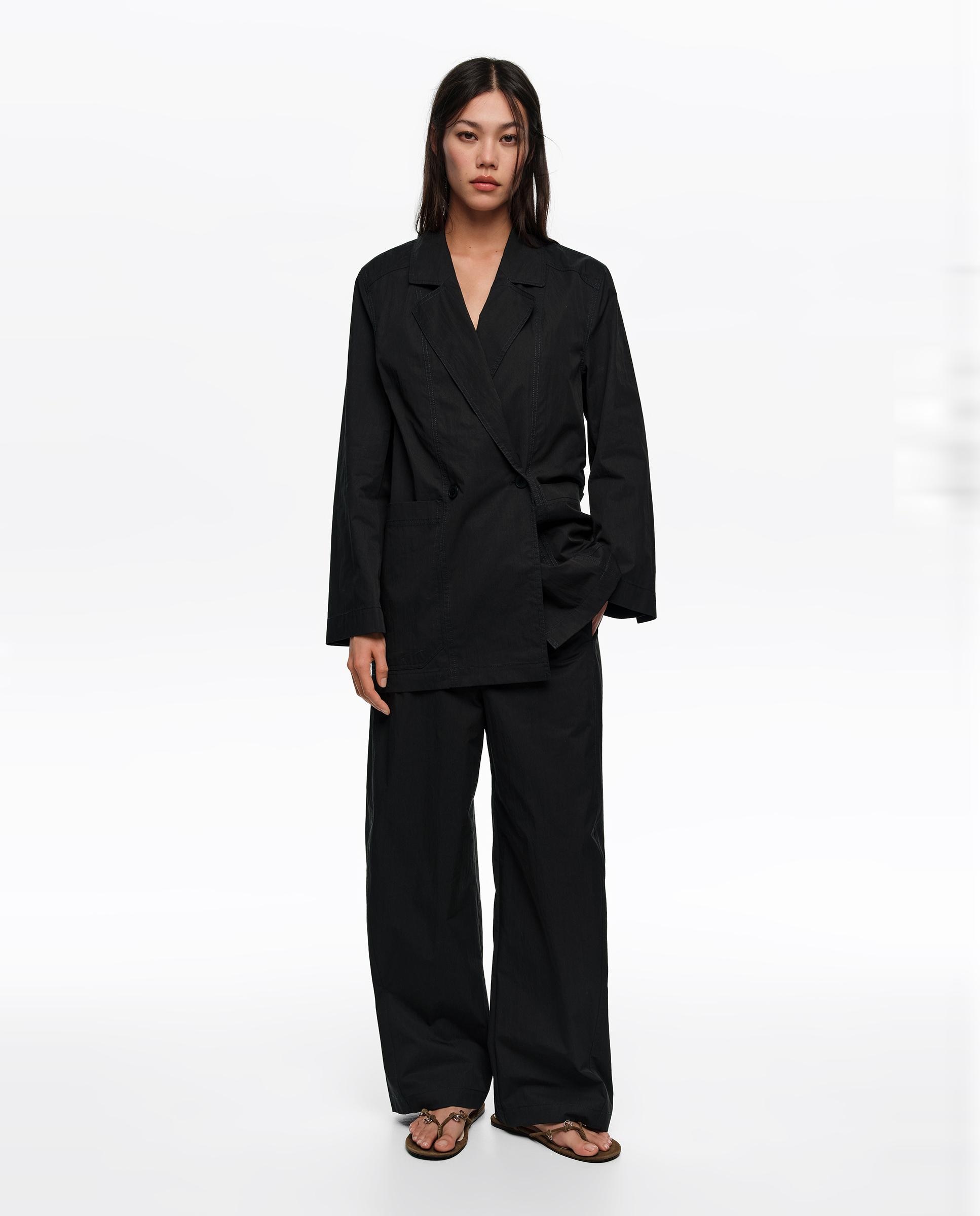 Bimba y Lola - Pantalones anchos de mujer barrel pespunteados.