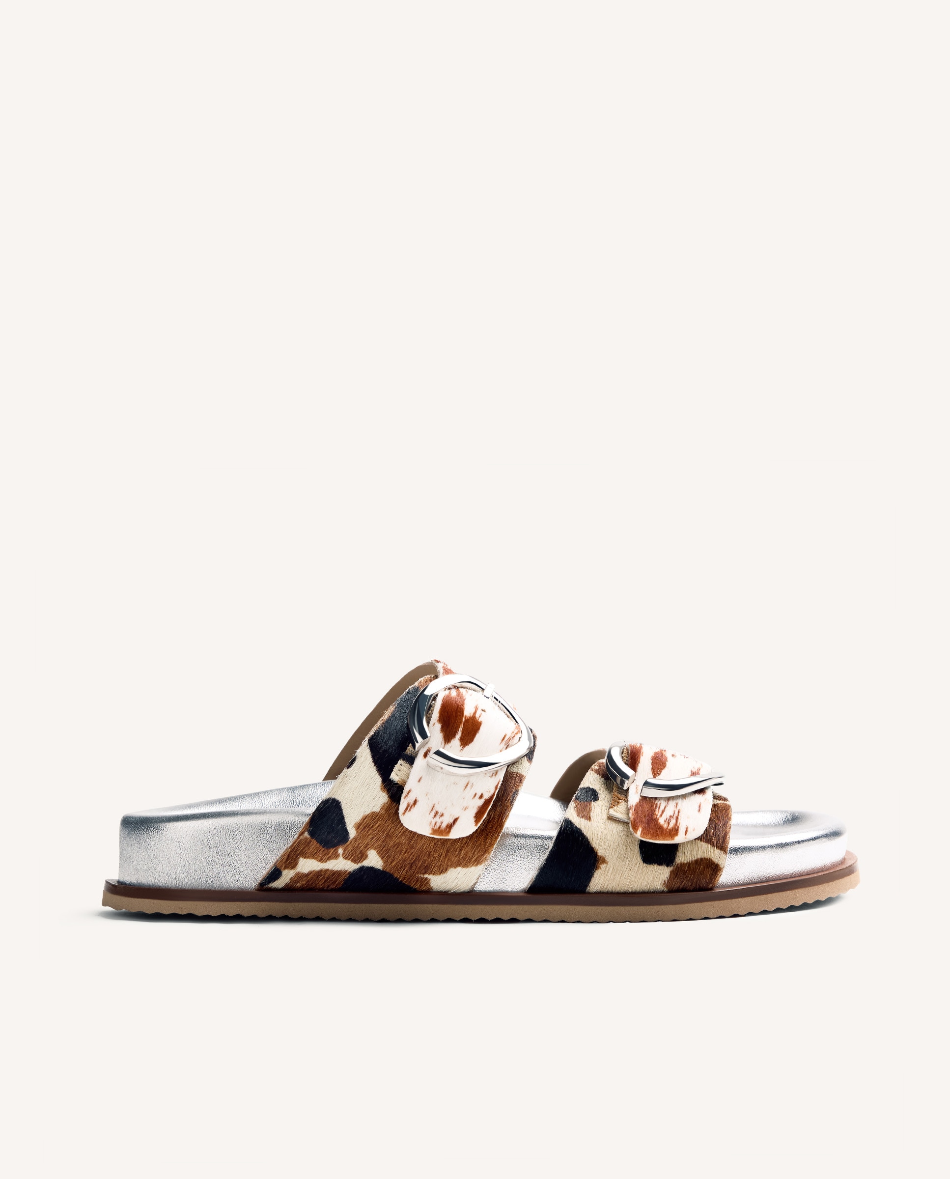 Gioseppo - Sandalias planas de mujer de piel tipo bio metalizado con estampado animal y hebillas.