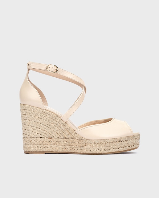 Imagen 0 de Sandalias de cuña de mujer de piel con hebilla ajustable al tobillo en color beige